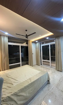 The Corner-Glazed Balcony & Teak Ceiling Master Suite